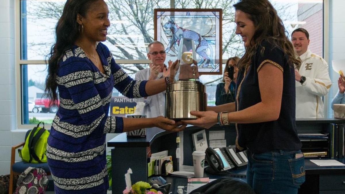 Erin Boley, left, of Elizabethtown High School, is surprised with the 2015-16 Gatorade National Girls Basketball Player of the Year trophy by 2014 WNBA MVP and 2007 Gatorade National Player of the Year Maya Moore, Wednesday, March 23, 2016 in Elizabethtown, Ky. The award recognizes outstanding athletic excellence as well as high standards of academic achievement and exemplary character demonstrated on and off the court.