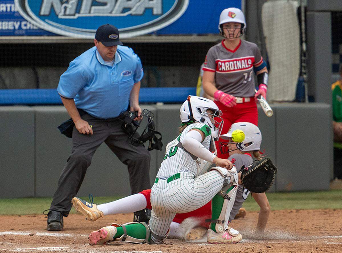Scott County’s Ella Millard slides in ahead of the throw to Rowan County’s Lauryn Eastham in the Cardinals’ 7-1 win in the KHSAA state softball quarterfinals at the University of Kentucky’s John Cropp Stadium on Saturday.