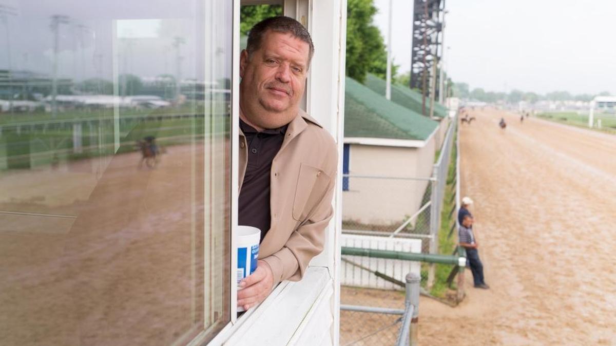Dale Romans, trainer of Blue Grass Stakes Winner and Derby 142 hopeful Brody’s Cause, watched horses train at Churchill Downs.