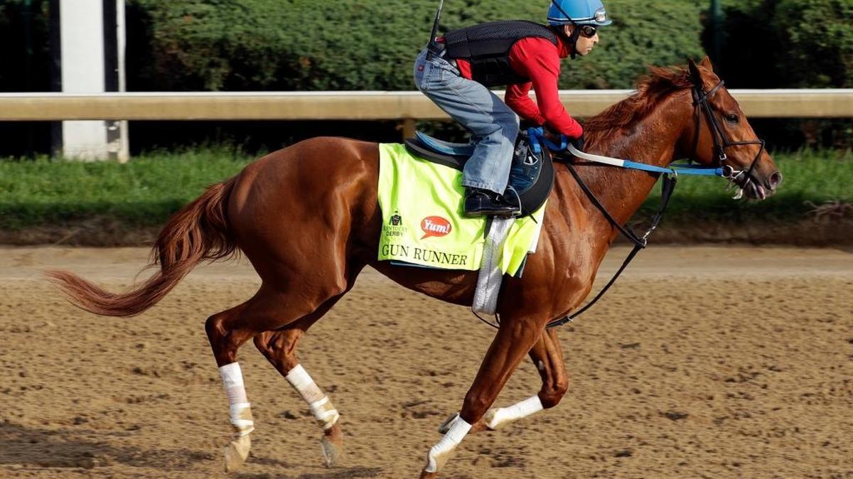 Exercise rider Carlos Rosas rides Kentucky Derby hopeful Gun Runner during a workout at Churchill Downs Monday, May 2, 2016, in Louisville, Ky. The 142nd running of the Kentucky Derby is scheduled for Saturday, May 7.