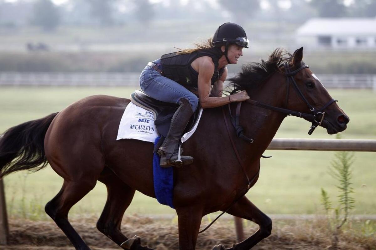 Stefanie Vetter, a student at North American Racing Academy, aboard Deja during her first breeze as a rider on the training track at the The Thoroughbred Center on Paris Pike in Lexington, Ky., Thursday, August 31, 2017.