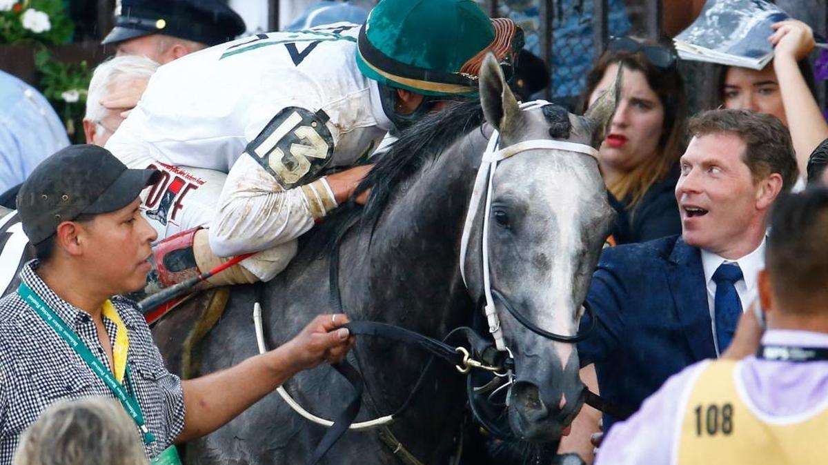 Jockey Irad Ortiz Jr., riding Creator, talked with part owner Bobby Flay after their Belmont Stakes win Saturday.