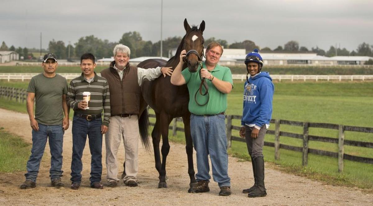 The barn crew that helps take care of War Eagle’s Love, left to right: Pedro Benitez, Reynel Torres, Tim Wilson (trainer), Bryan Waldridge (owner) and Anthony Stephen (jockey who rode the filly to Friday’s win at Keeneland).