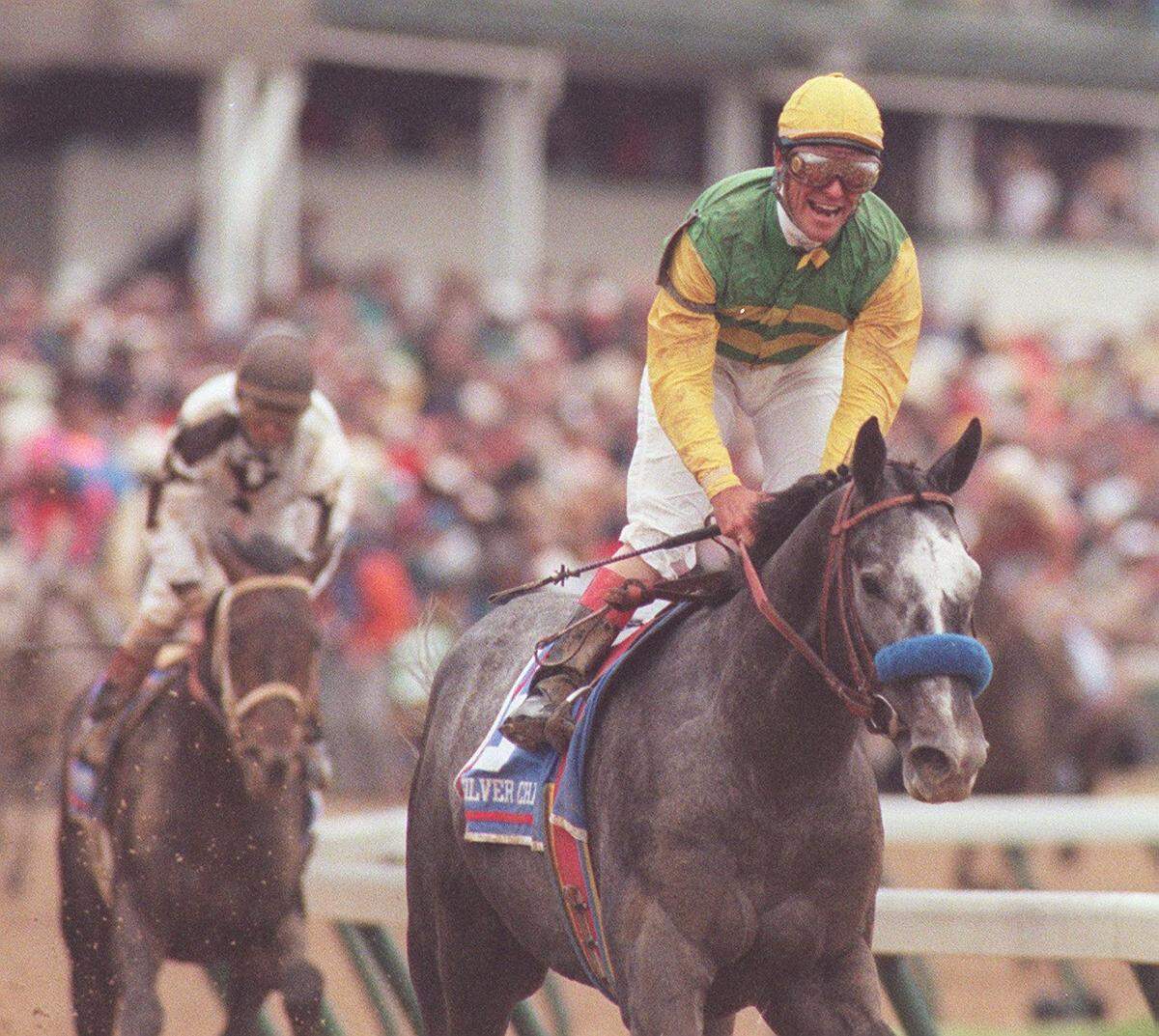 Jockey Gary Stevens smiles as he and Silver Charm pull up in the first turn  after winning the 123rd running of the KY Derby