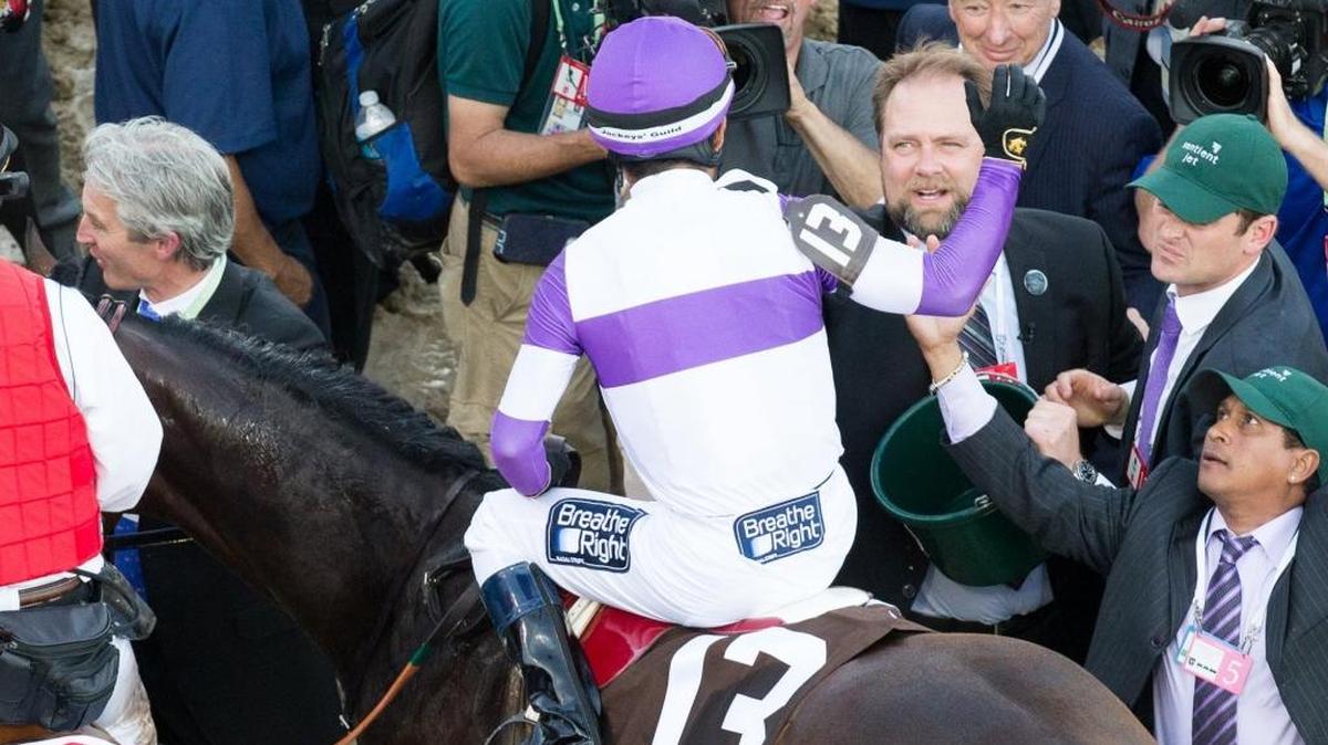 Trainer Doug O’Neill greeted Nyquist with Mario Gutierrez aboard after winning the Kentucky Derby at Churchill Downs on Saturday, May 7, 2016.