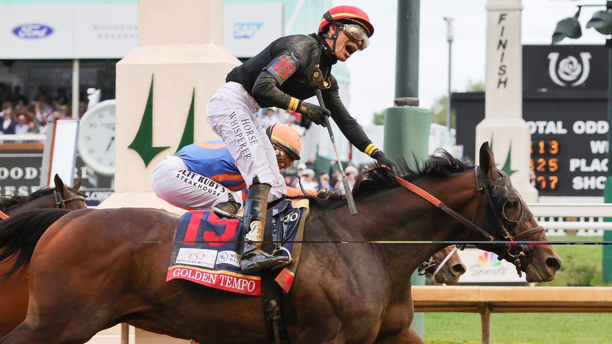 Jockey Jose Ortiz celebrates as he rides Golden Tempo to a win in the 152nd Kentucky Derby on Saturday, May 2, 2026, at Churchill Downs.