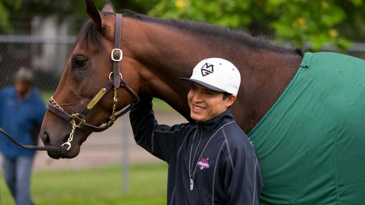 Kentucky Derby 142 winner Nyquist jockey Mario Gutierrez had his photo taken with the colt at his barn on the backside the morning after the race, Sunday, May 08, 2016 at Churchill Downs in Louisville.