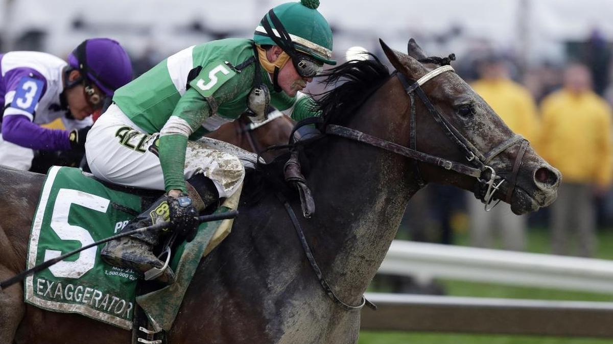In this May 21, 2016, file photo, Exaggerator (5), with Kent Desormeaux, aboard moves past Nyquist, ridden by Mario Gutierrez, on the way to winning the 141st Preakness Stakes horse race at Pimlico Race Course in Baltimore. Next Saturday there'll be no Triple try. No Kentucky Derby winner, either. And no sellout crowd. Just Preakness winner Exaggerator taking on 3-year-olds he's already beaten and a few others in their first Triple Crown race.