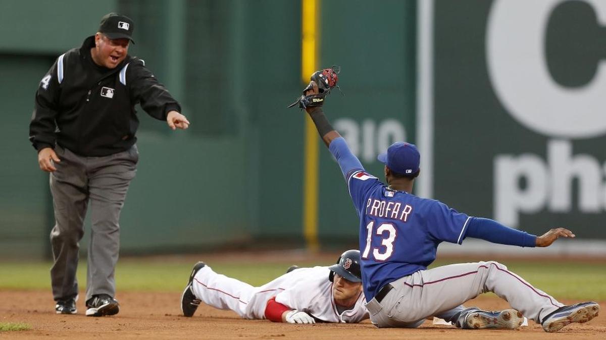 Umpire Sam Holbrook, left, is working a World Series for the second time this year, having also done so in 2010.