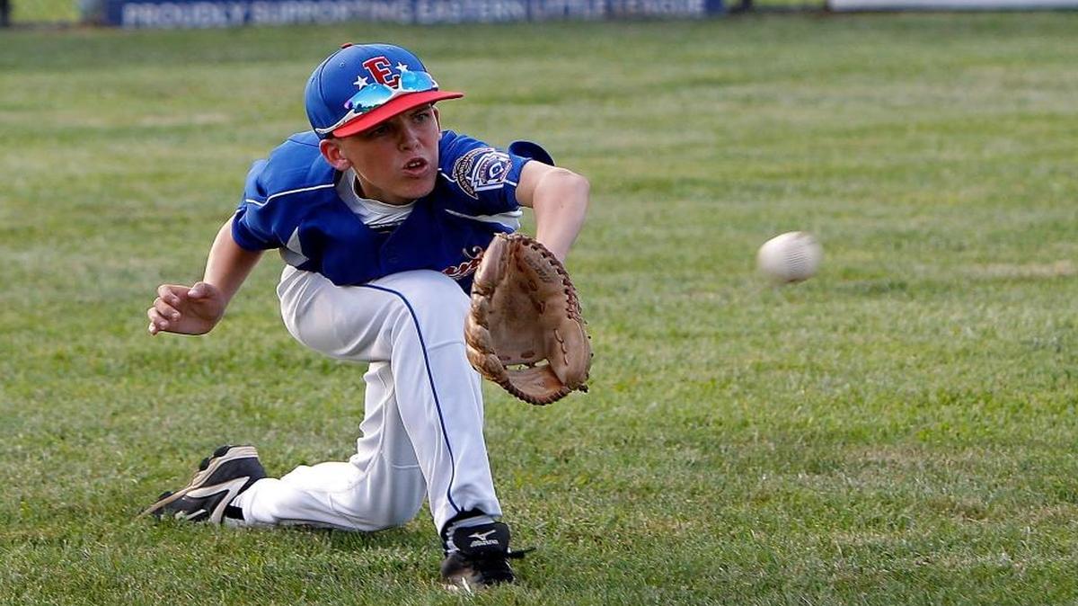 Eastern’s Brady Robeson stretched to make a catch during the 12-year-old All-Star team’s practice at Lansdowne Merrick Park last week. Robeson drove in the winning run on Sunday in a 1-0 victory over New Albany (Ind.) in Eastern’s opening game of the Great Lakes Regional Tournament in Westfield, Ind.