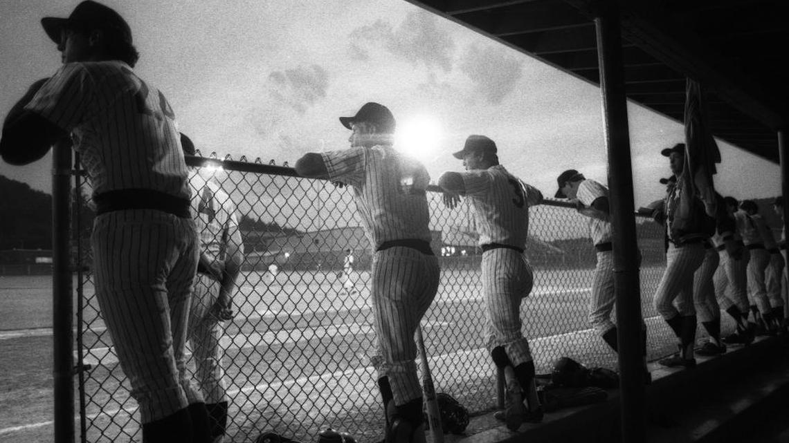 Paintsville Yankees players lined the dugout’s top step to keep an eye on their season-opening game against the Pikeville Brewers in June 1982.