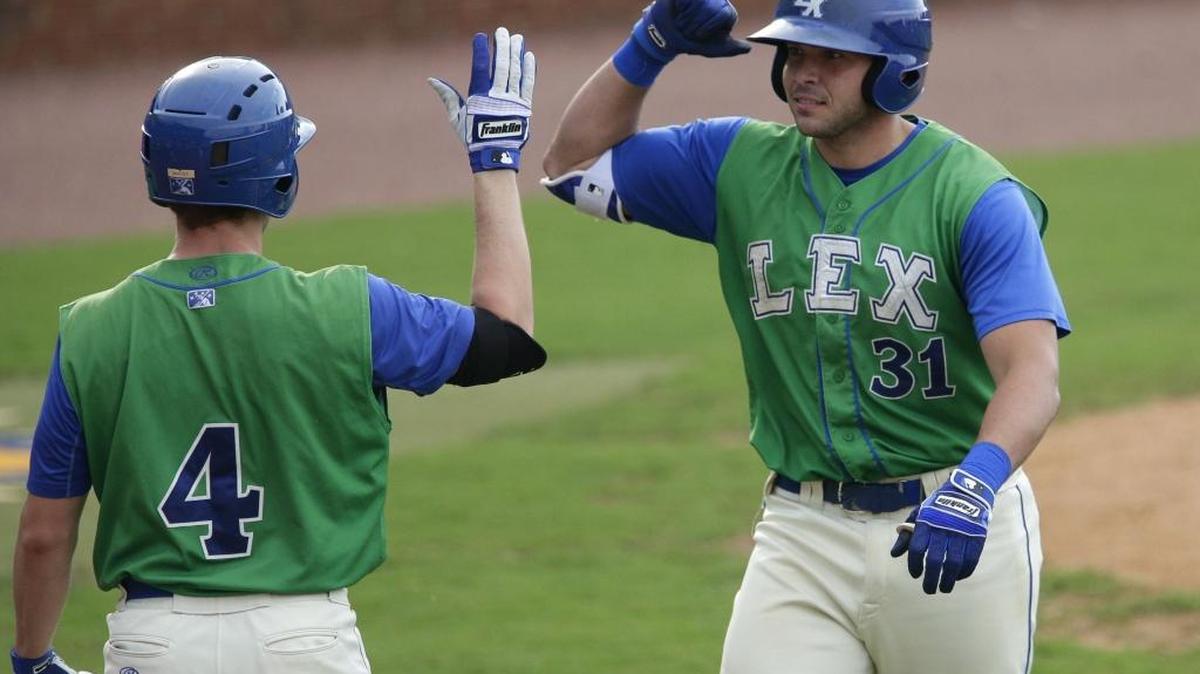 Brandon Dulin high-fived Travis Maezes (4) after hitting a two-run homer for the Legends at Whitaker Bank Ballpark in August.