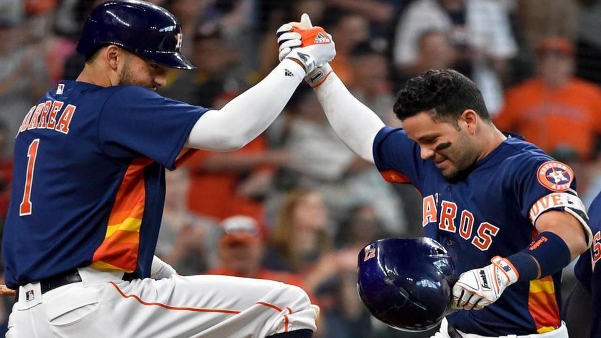 Houston Astros' Jose Altuve, right, celebrates his two-run home run off Los Angeles Angels starting pitcher Tim Lincecum with Carlos Correa in the second inning of a baseball game, Sunday, July 24, 2016, in Houston. (AP Photo/Eric Christian Smith)