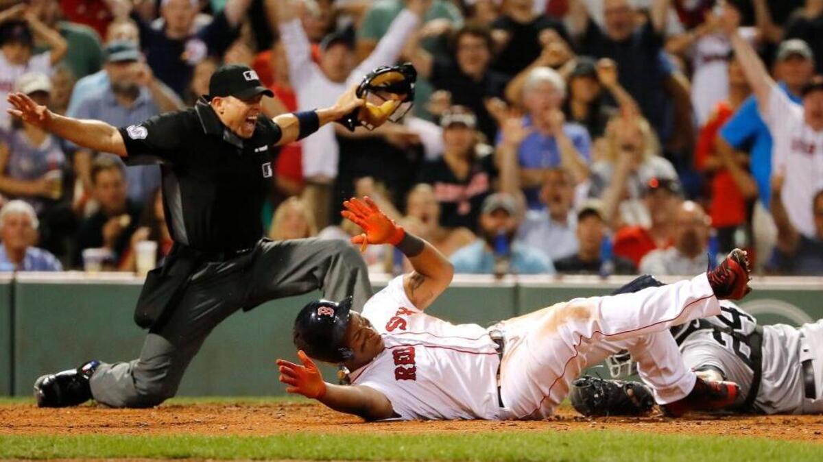 The Red Sox’s Rafael Devers was called safe at the plate by umpire Tripp Gibson as Yankees catcher Gary Sanchez couldn’t get the tag on him during the fifth inning at Fenway Park in Boston on Aug. 19, 2017.
