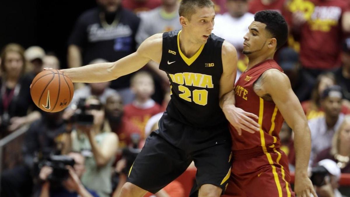 FILE - In this Dec. 10, 2015, file photo, Iowa forward Jarrod Uthoff (20) tries to drive around Iowa State guard Naz Mitrou-Long, right, during the first half of an NCAA college basketball game in Ames, Iowa. The eighth-ranked Hawkeyes’ 1-2 punch of Uthoff (18.8 points) and Peter Jok (16.3) leads an offense ranked 11th in KenPom’s adjusted efficiency ratings (118 points per 100 possessions).