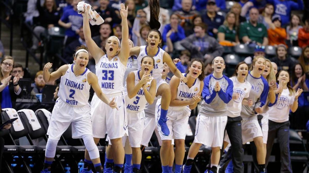 The Thomas More bench celebrated during the first half of the championship game against Tufts at the women's NCAA Division III basketball tournament in Indianapolis on Monday, April 4, 2016.