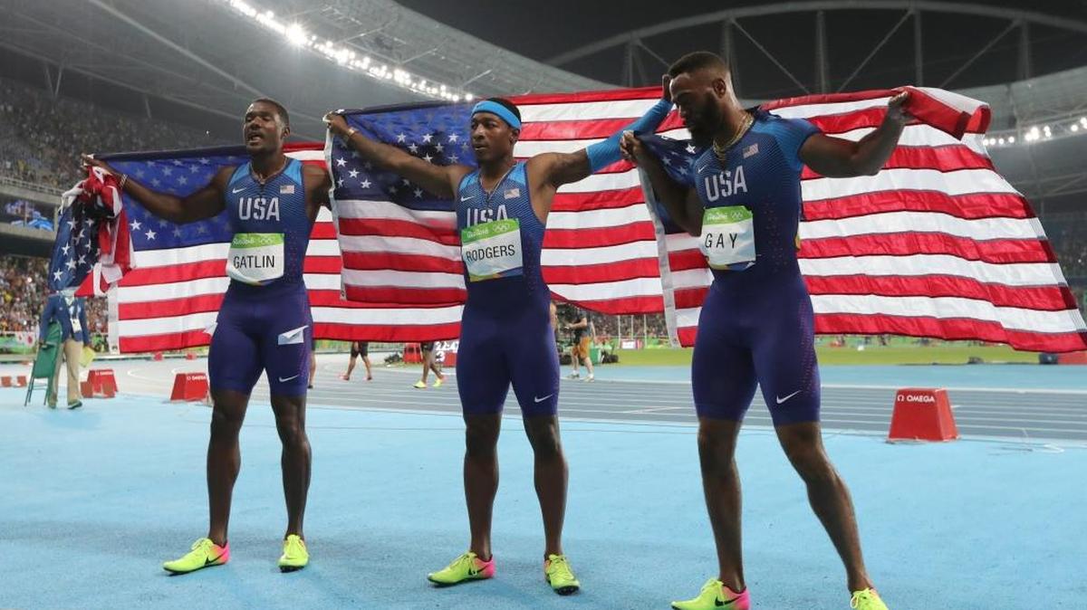 Members of the United States team from left, Justin Gatlin, Mike Rodgers and Tyson Gay celebrated after winning bronze in the 4-by-100 relay on Friday night. The team was later disqualified.