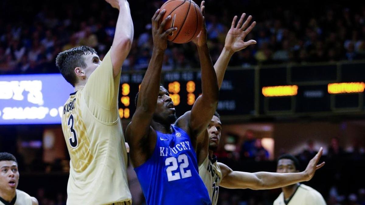 Kentucky’s Alex Poythress (22) was called for a travel as he tried to spin inside around Vanderbilt's Luke Kornet (3) on Saturday, Feb. 27, in Nashville.