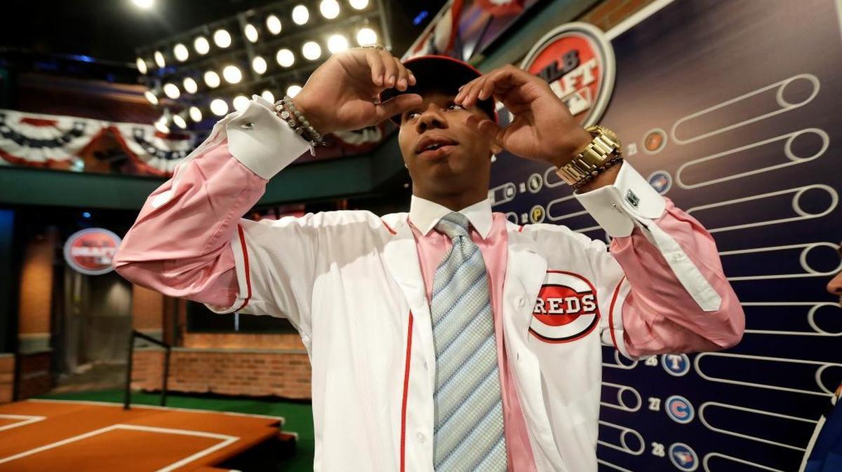 Hunter Greene, a pitcher and shortstop from Notre Dame High School in Sherman Oaks, Calif., walks off the stage after being selected No. 2 by the Cincinnati Reds in the first round of the Major League Baseball draft, Monday, June 12, 2017, in Secaucus, N.J.