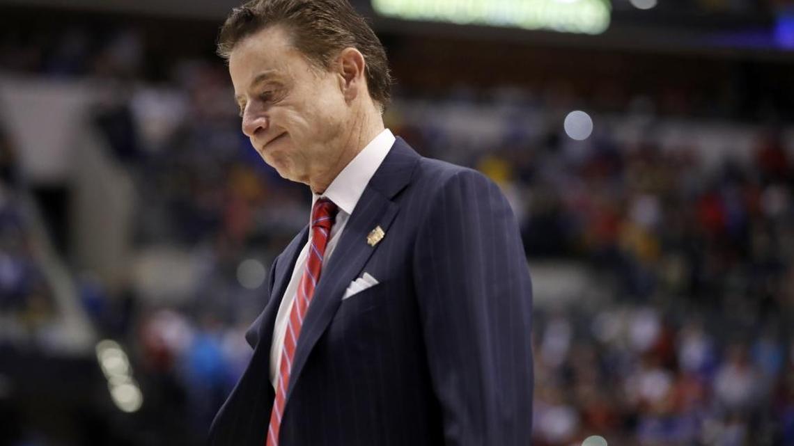 Louisville head coach Rick Pitino walked off the court on March 19 after a 73-69 loss to Michigan in a second-round game in the men’s NCAA college basketball tournament in Indianapolis. Louisville acknowledged Tuesday that it is part of a federal investigation into corruption in college basketball.
