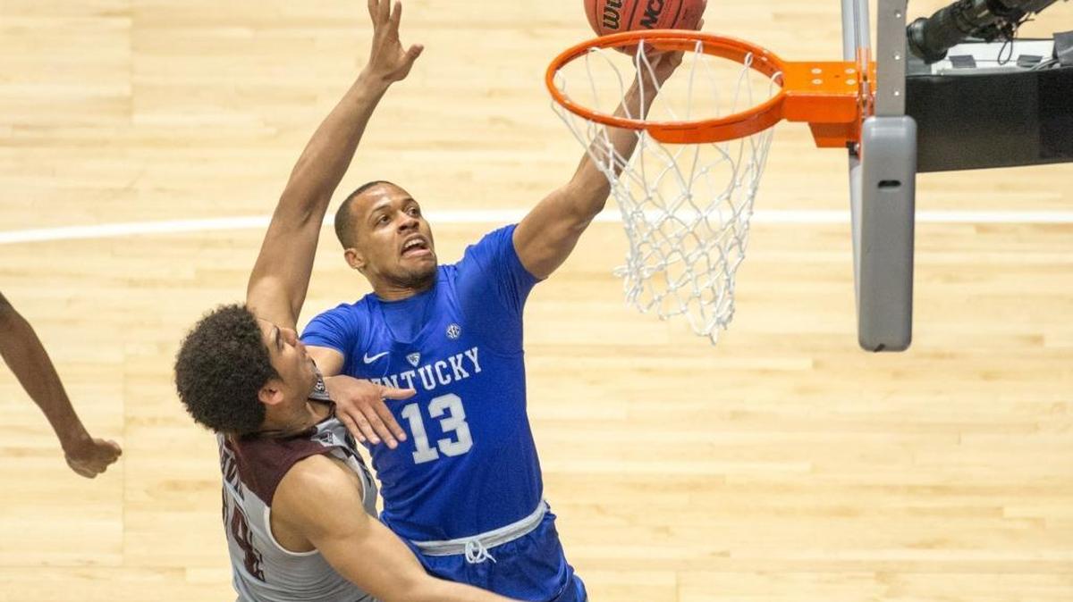 Kentucky guard Isaiah Briscoe (13) shot over Texas A&M center Tyler Davis (34) during the championship game of the SEC Tournament on March 13 in Nashville.