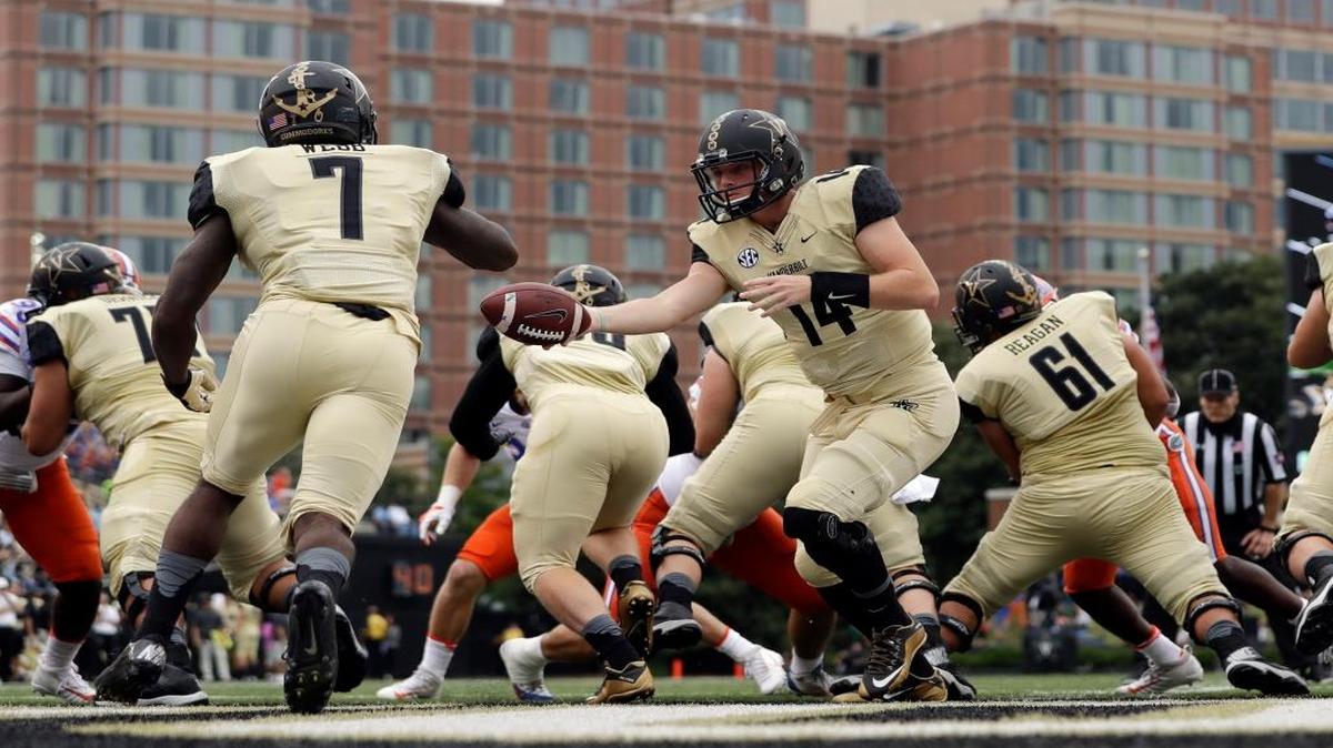 Vanderbilt quarterback Kyle Shurmur (14) hands off to running back Ralph Webb (7) in the first half of an NCAA college football game against Florida Saturday, Oct. 1, 2016, in Nashville, Tenn. Florida beat the Commodores 13-6.