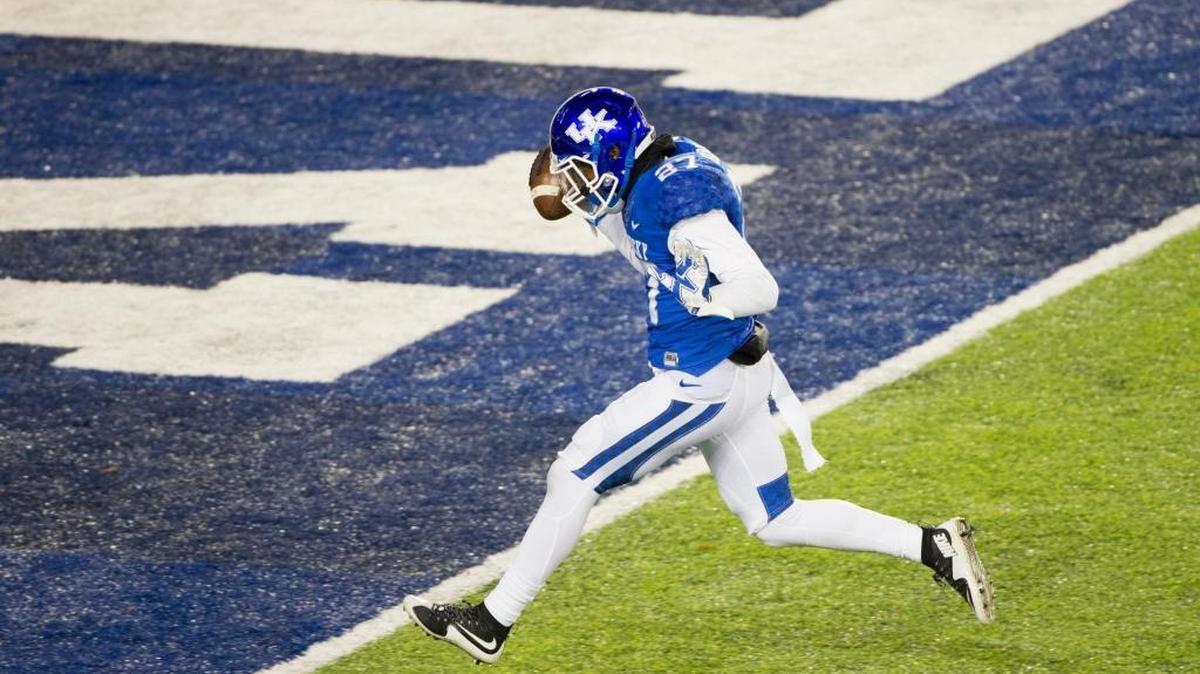 Kentucky safety Mike Edwards intercepts a pass and returns it for a touchdown in the second half of UK’s win over Charlotte on Saturday, Nov. 21, 2015 at Commonwealth Stadium in Lexington.