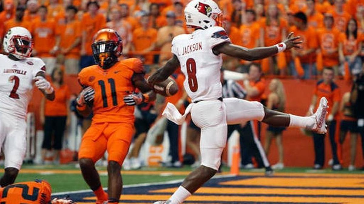 Louisville’s Lamar Jackson high-steps into the end zone for a touchdown during the Cards’ 62-28 win at Syracuse on Friday, Sept. 9, 2016.
