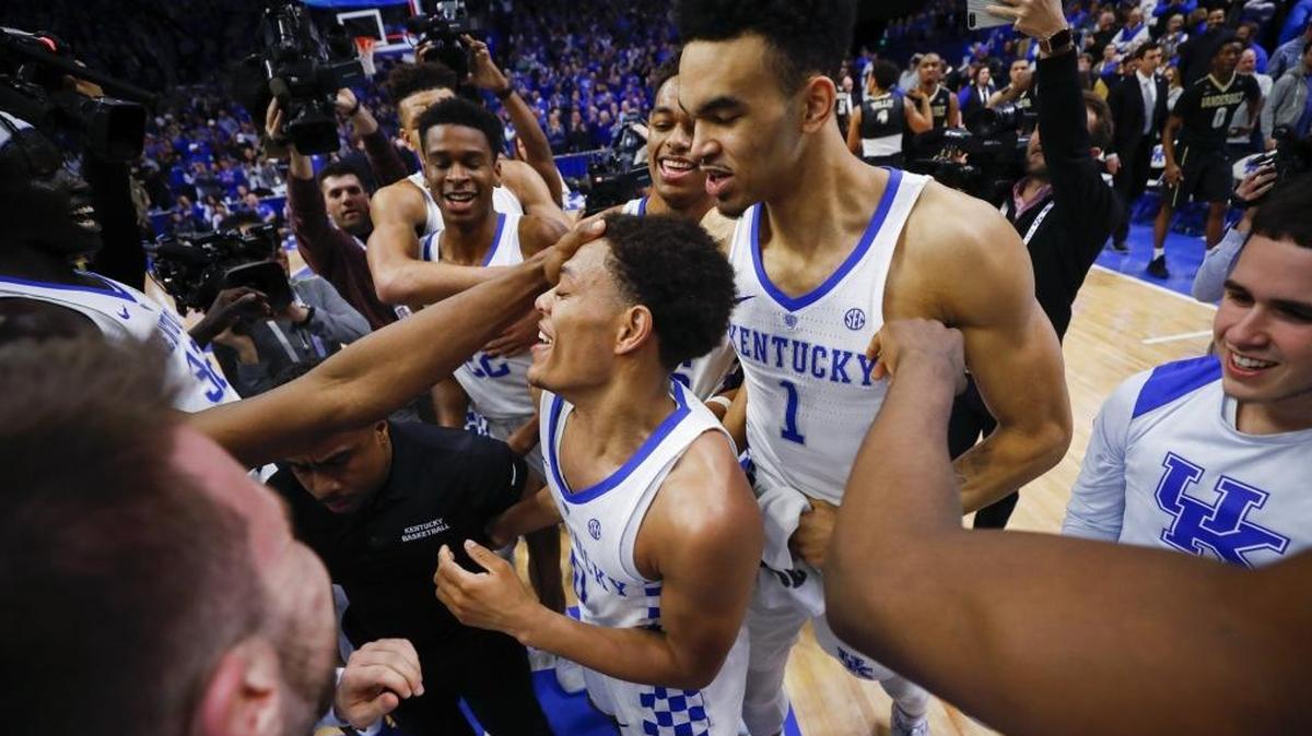 Kentucky guard Quade Green (0) celebrates with teammates following his game winning basket as UK beat Vanderbilt 83-81 in overtime in a college basketball game at Rupp Arena in Lexington, Ky., Tuesday, Jan. 30, 2018.
