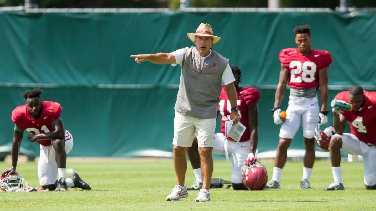 Alabama coach Nick Saban works with his players during the NCAA college football team’s practice Tuesday, Aug. 16, 2016, in Tuscaloosa, Ala.
