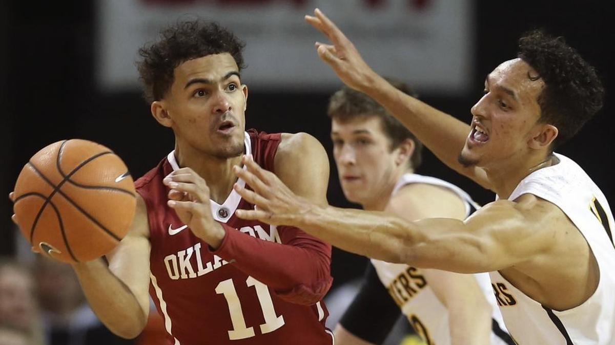 Oklahoma guard Trae Young, left, looked for a teammate while Wichita State guard Landry Shamet defended during Oklahoma’s upset of the Shockers last weekend. Young leads the nation in scoring.