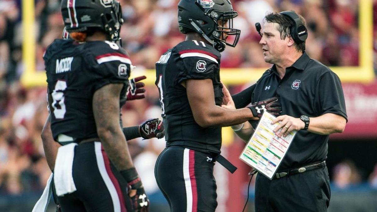 South Carolina Coach Will Muschamp, right, talked with starting quarterback Brandon McIlwain (11) during the first half against East Carolina on Saturday, Sept. 17, 2016, in Columbia, S.C. South Carolina defeated East Carolina 20-15.
