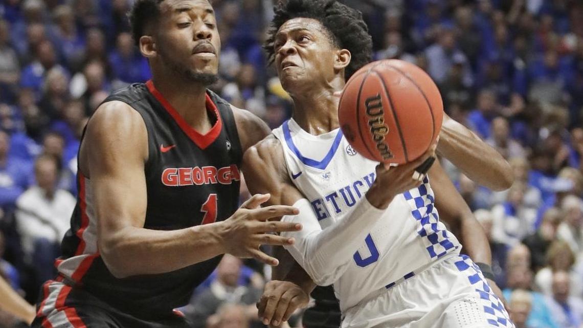 Kentucky guard De’Aaron Fox (0) drives against Georgia forward Yante Maten (1) during the first half of UK’s 71-60 win in the Southeastern Conference tournament on Friday, March 10, 2017, in Nashville, Tenn.