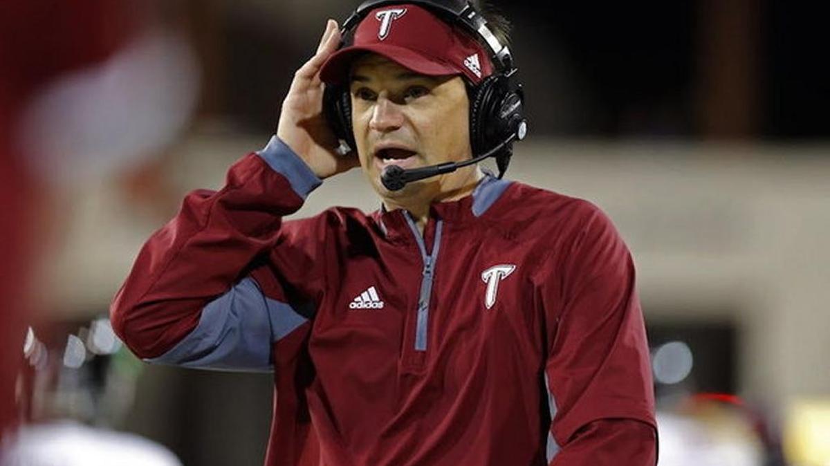 Troy head coach Neal Brown adjusts his headphones during the second half of an NCAA college football game against New Mexico State in Las Cruces, N.M., Saturday, Oct. 24, 2015. Troy won 52-7.
