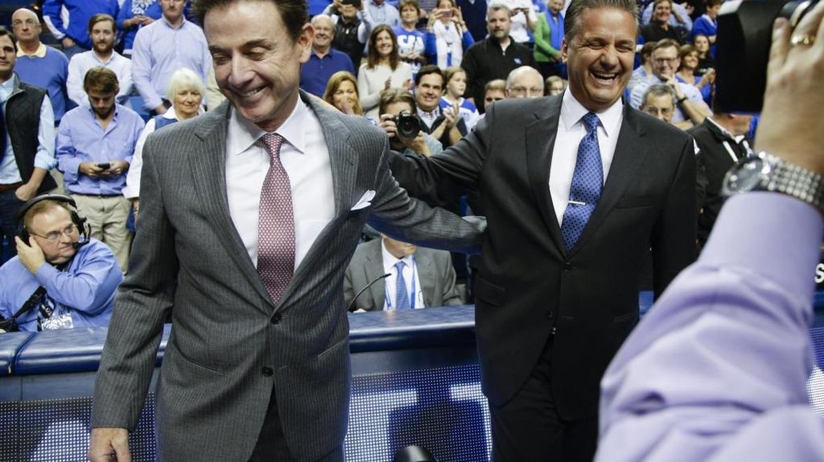 Louisville Cardinals head coach Rick Pitino laughed with Kentucky Wildcats head coach John Calipari before the game as Kentucky defeated Louisville 75-73 on Saturday December 26, 2015, in Lexington, Ky.