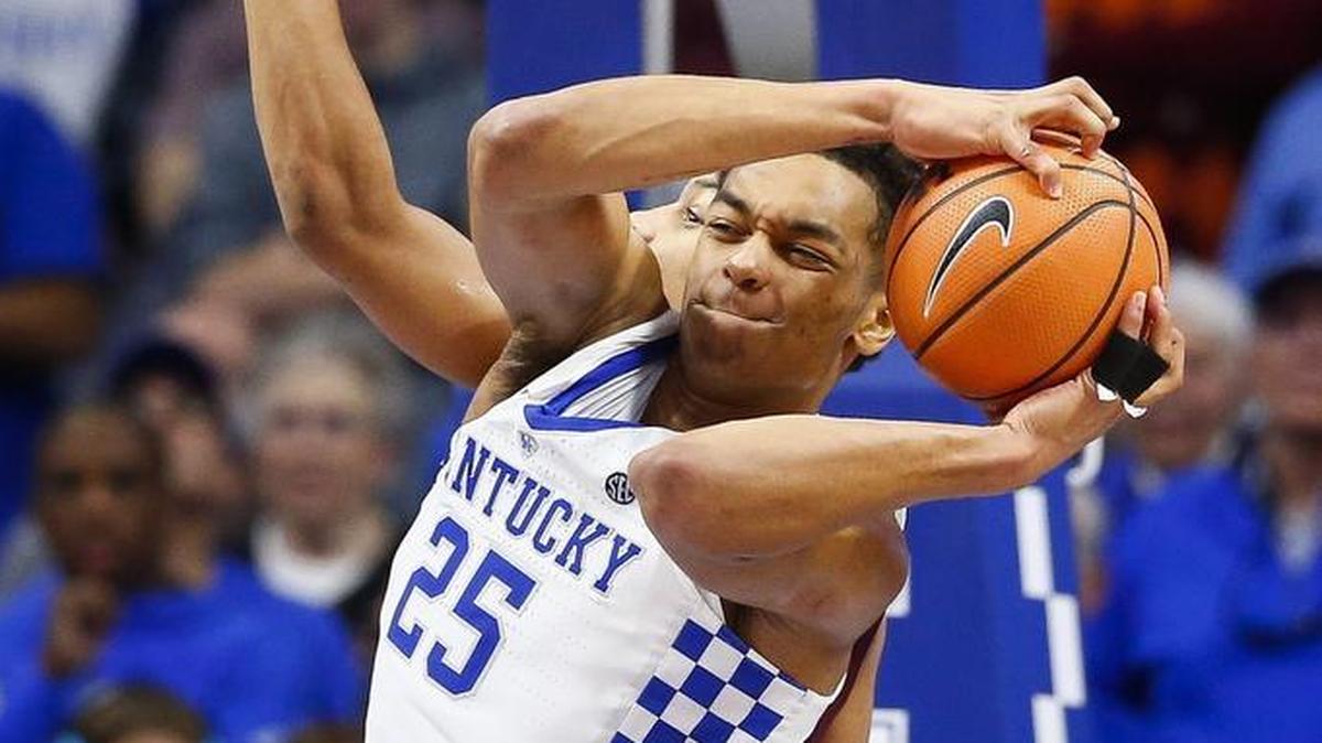 Kentucky freshman forward PJ Washington (25) rebounds the ball past Virginia Tech Hokies guard Justin Robinson (5) during UK’s 93-86 win at Rupp Arena in Lexington, Ky., Saturday, Dec. 16, 2017. Washington finished with 11 points and five rebounds.