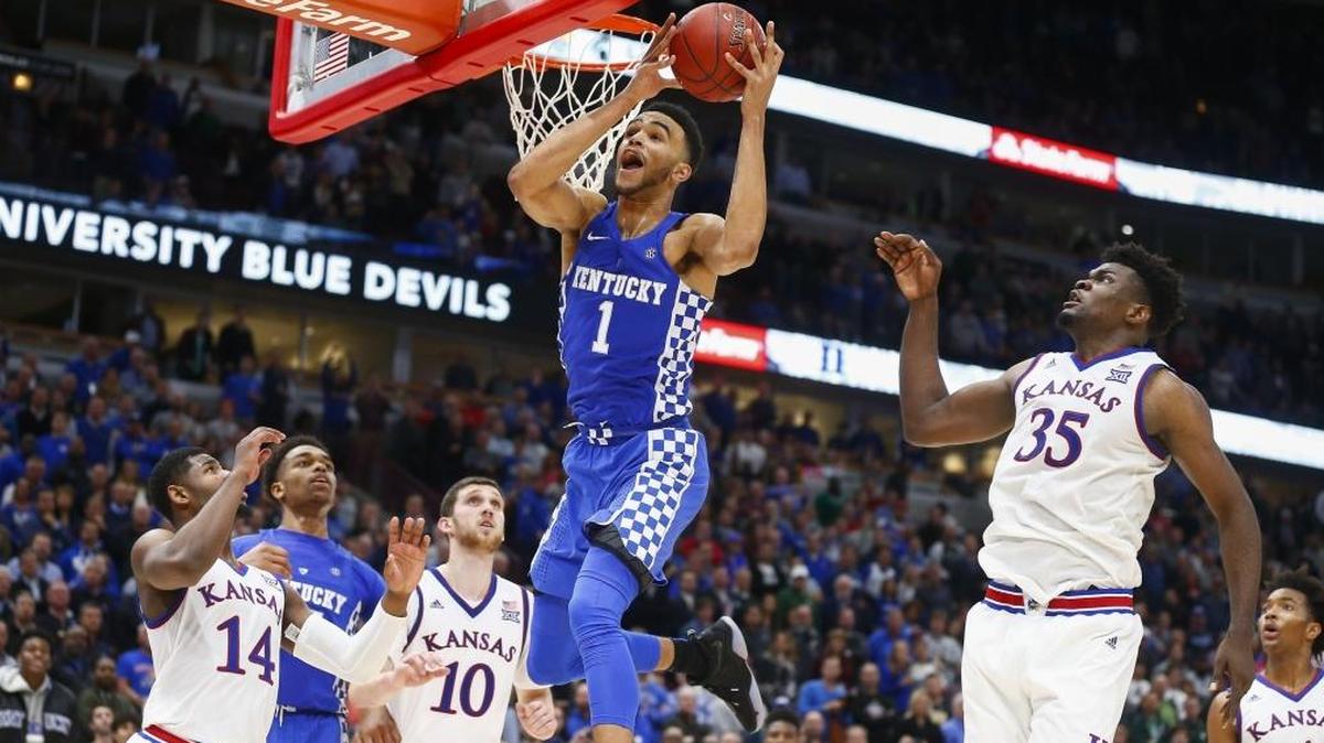 Kentucky forward Sacha Killeya-Jones (1) rebounds the ball past Kansas guard Sviatoslav Mykhailiuk (10), center Udoka Azubuike (35) and guard Malik Newman (14) during UK’s 65-61 loss to the Jayhawks in the State Farm Champions Classic at the United Center in Chicago, Ill., Tuesday, Nov. 14, 2017.
