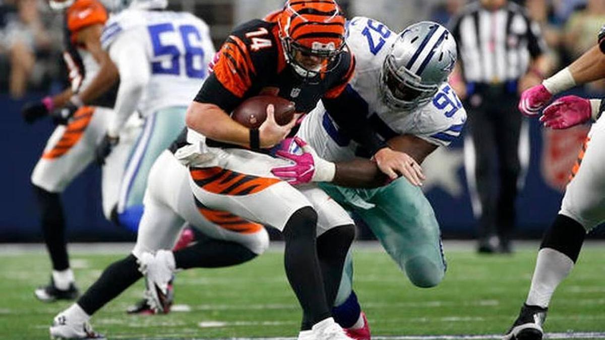 Cincinnati Bengals quarterback Andy Dalton (14) is sacked by Dallas Cowboys defensive tackle Terrell McClain (97) in the second half the Cowboys’ 28-14 win on Sunday, Oct. 9, 2016, in Arlington, Texas.