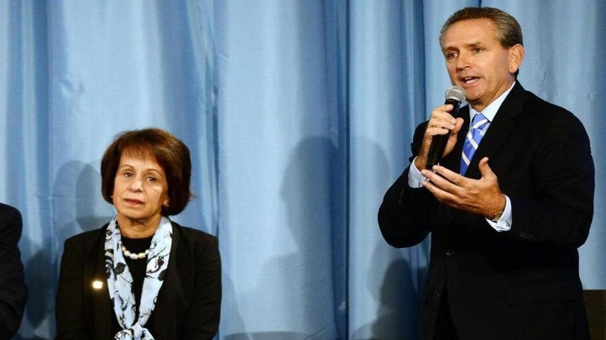 University of North Carolina chancellor Carol L. Folt listens as Bubba Cunningham, UNC-Chapel Hill athletics director, answers a question about future NCAA sanctions in 2014.