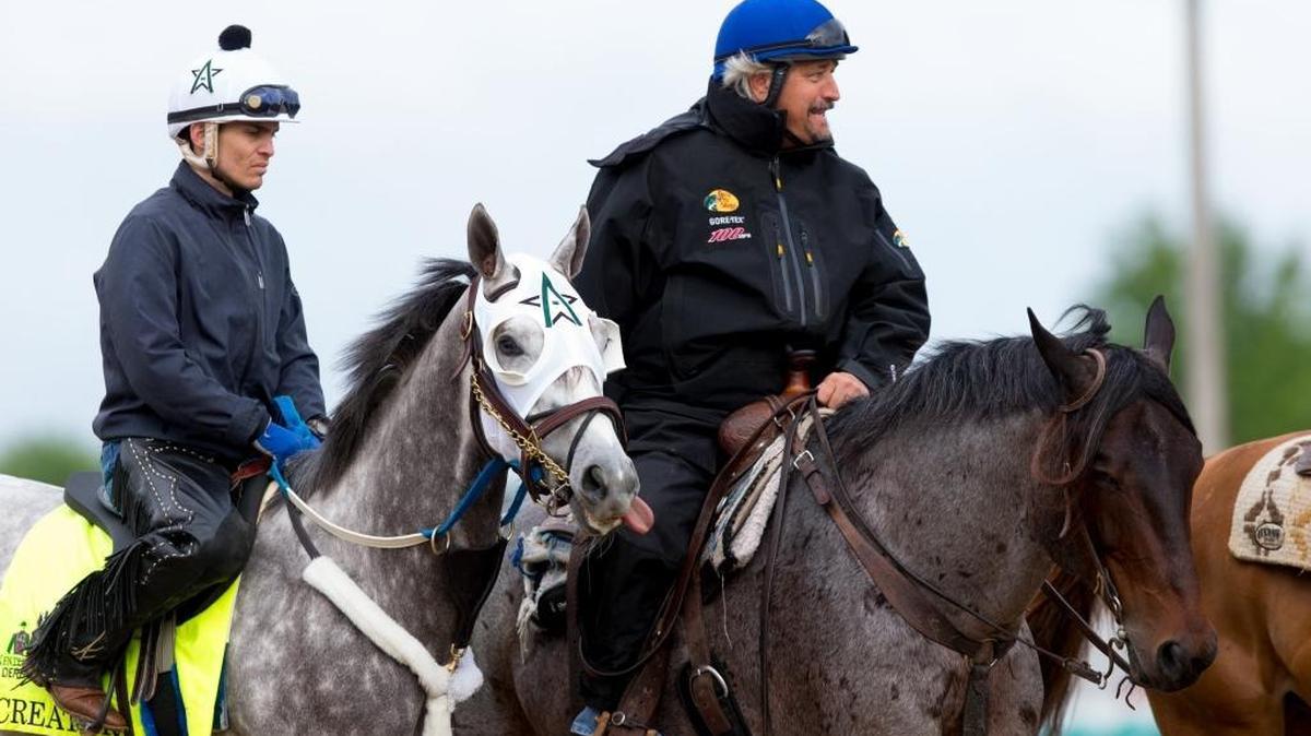 Trainer Steve Asmussen, right, led Kentucky Derby entrant Creator, with Abel Flores up, to the Churchill Downs track on Thursday. Creator won the Arkansas Derby on April 16.