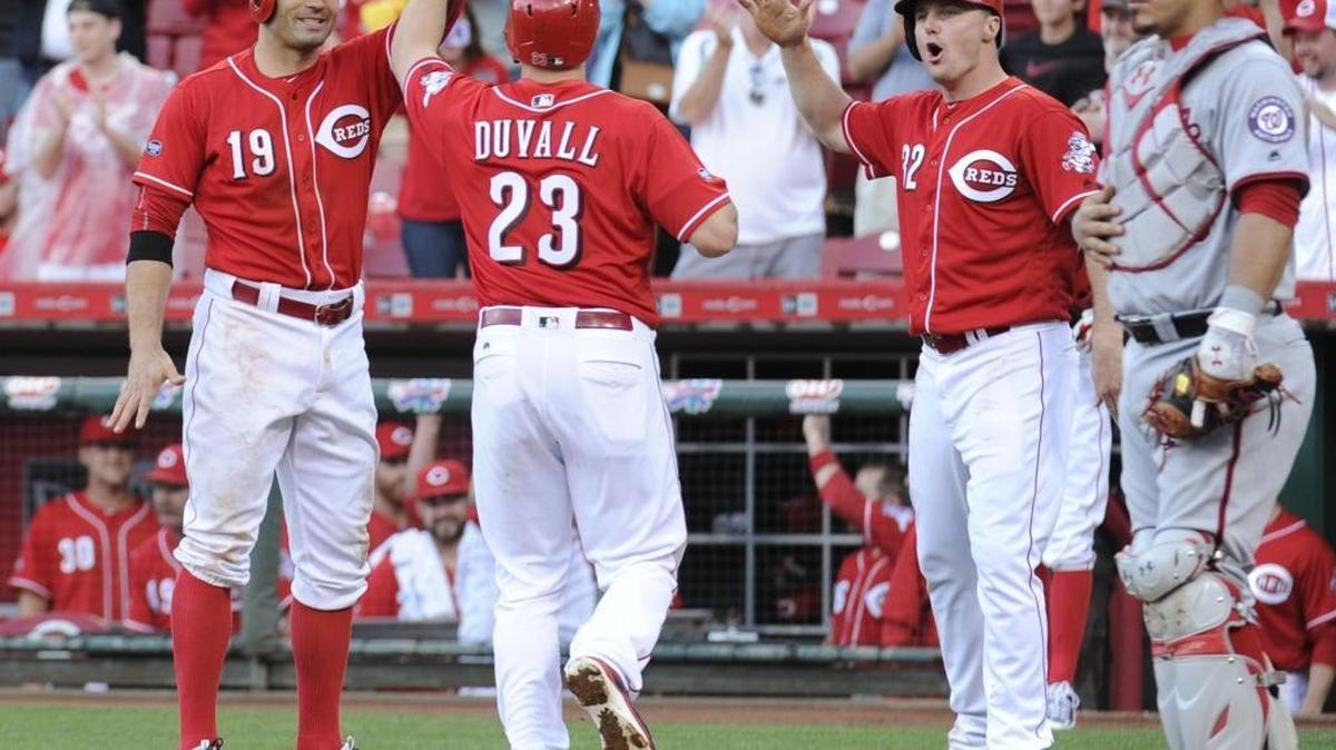 Adam Duvall is congratulated by Joey Votto (19) and Jay Bruce (32) after hitting a three-run homer to give the Reds a 6-3 victory during the Washington Nationals-Cincinnati Reds game at Great American Ballpark in Cincinnati, Ohio, on Saturday June 4, 2016. Duvall and Bruce have been two of the few bright spots for Cincinnati this season.
