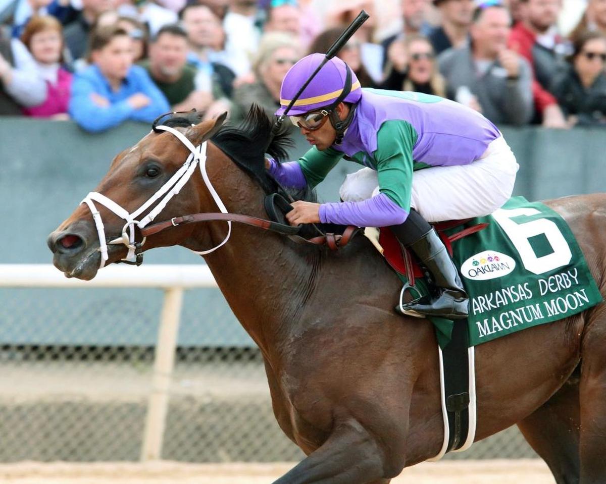 Magnum Moon, with jockey Luis Saez, wins the Arkansas Derby horse race Saturday, April 14, 2018, at Oaklawn Park in Hot Springs, Ark. Trained by Todd Pletcher, Magnum Moon has won all four of his career starts.