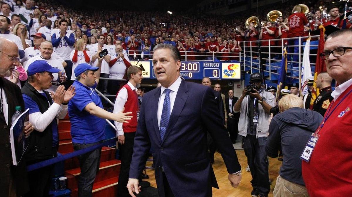 Kentucky Coach John Calipari came out onto the court before his the Cats’ game against Kansas in Allen Fieldhouse on Saturday in Lawrence, Kan.