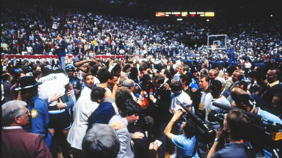 Villanova players and coaches were swarmed by media and fans after upsetting Georgetown in the NCAA championship game on April 1, 1985, in Rupp Arena. Eighth-seeded Villanova, coached by Rollie Massimino, won the national title with a 66-64 victory over top-seeded Georgetown, coached by John Thompson.