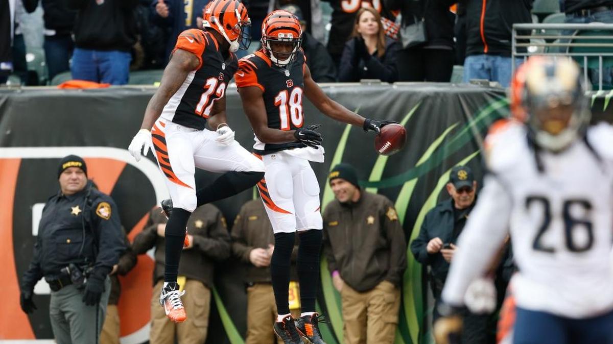 Bengals wide receiver A.J. Green (18) celebrated catching a touchdown pass with teammate Mohamed Sanu in the first half against the Rams on Sunday.