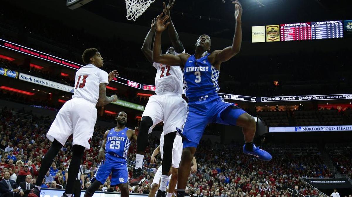 Wildcat Bam Adebayo (3) battled for a rebound with Louisville forward Deng Adel (22) as the host Cardinals won 73-70 on Wednesday. Louisville outrebounded UK 40-36.