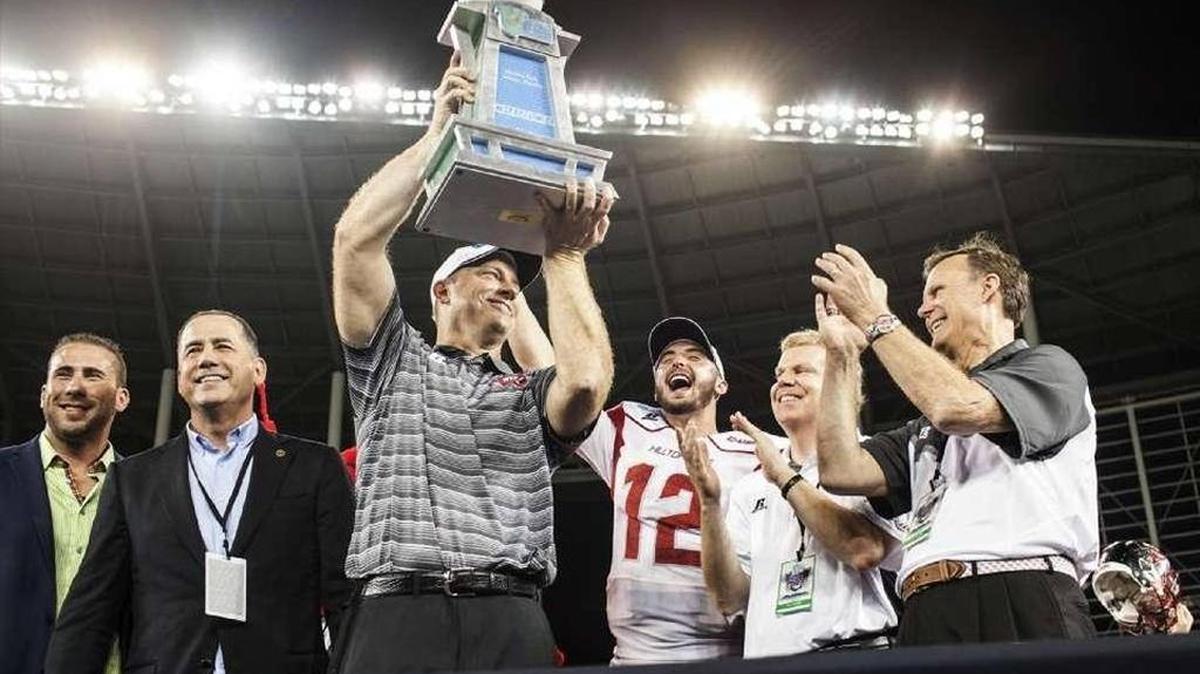 Western Kentucky coach Jeff Brohm lifted the Miami Beach Bowl trophy after his team beat South Florida 45-35 last season. The Hilltoppers must replace prolific quarterback Brandon Doughty (12) in 2016.