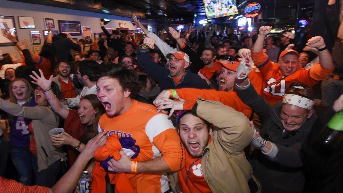 Clemson fans celebrate after the team scored the game-winning touchdown during the NCAA college football playoff championship against Alabama, Monday, Jan. 9, 2017, in Clemson, S.C.