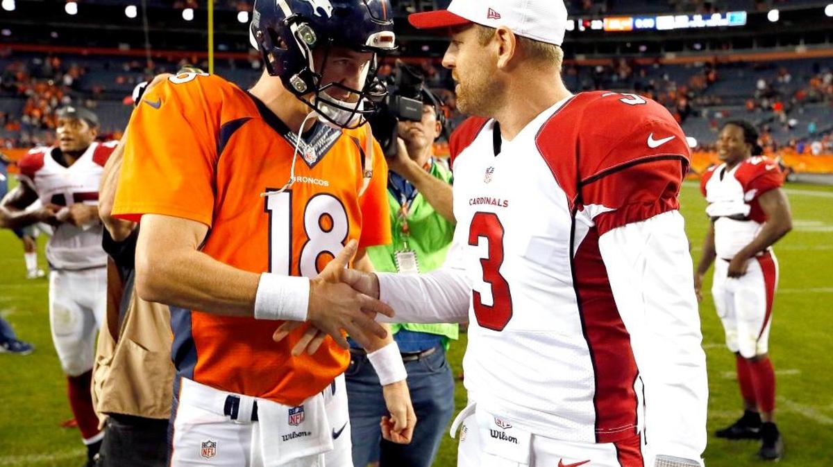 Broncos quarterback Peyton Manning, left, and Cardinals quarterback Carson Palmer talked after their teams’ preseason game on Sept. 3, 2015, in Denver.