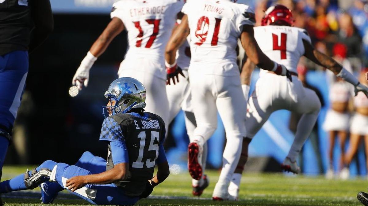 Kentucky quarterback Stephen Johnson (15) reacts after being sacked by Louisville linebacker Stacy Thomas (32) during UK’s 44-17 loss to Louisville at Kroger Field in Lexington, Ky., Saturday, Nov. 25, 2017.